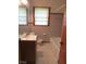 Cozy bathroom with tiled walls, offering functionality in a compact space, perfect for everyday use at 1410 Willis Mill Sw Rd, Atlanta, GA 30311
