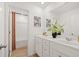 Bright bathroom featuring a double vanity, mirrors, and a shower tub at 229 Paisley Way, Locust Grove, GA 30248
