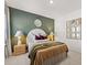 Comfortable bedroom with a queen sized bed, soft textures, and stylish decor at 229 Paisley Way, Locust Grove, GA 30248