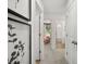 Hallway with modern decor that leads to the bathroom and a pink-themed bedroom at 229 Paisley Way, Locust Grove, GA 30248
