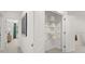 Hallway with a closet and view of another room with green accents and natural light at 229 Paisley Way, Locust Grove, GA 30248
