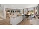 Open floor plan with kitchen island, dining area, and comfortable living space at 229 Paisley Way, Locust Grove, GA 30248