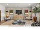 Bright living room featuring stylish decor, modern furniture, and a large flat screen television at 229 Paisley Way, Locust Grove, GA 30248