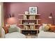 Comfortable living room area, styled with cozy chairs, pillows, and modern shelving at 229 Paisley Way, Locust Grove, GA 30248
