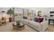 Well-lit living room and kitchen combo offering an open-concept living space at 229 Paisley Way, Locust Grove, GA 30248