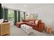 Inviting living room with a comfortable sectional sofa and large windows at 229 Paisley Way, Locust Grove, GA 30248