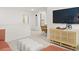 Bright living space with a sectional sofa, desk, television, and modern decor at 229 Paisley Way, Locust Grove, GA 30248
