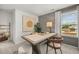 Inviting office space with large desk, artwork, natural light, and neutral decor at 229 Paisley Way, Locust Grove, GA 30248