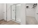 Walk-in shower featuring glass doors and a bright and clean look at 229 Paisley Way, Locust Grove, GA 30248