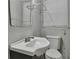 Simple bathroom featuring a white sink and toilet at 3357 Huntwood Ct, Decatur, GA 30034