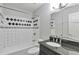 Clean bathroom featuring shower/tub, granite countertop and modern finishes at 3357 Huntwood Ct, Decatur, GA 30034
