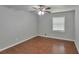 Well-lit bedroom featuring hardwood floors and a ceiling fan at 3357 Huntwood Ct, Decatur, GA 30034