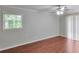 Bright bedroom with wood flooring, large windows, and access to the backyard at 3357 Huntwood Ct, Decatur, GA 30034