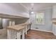Bright eat-in kitchen features granite counters, white cabinets, modern hardware and wood-look flooring at 3357 Huntwood Ct, Decatur, GA 30034