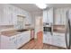 This kitchen features granite countertops, stainless steel appliances, and updated cabinets and hardware at 3357 Huntwood Ct, Decatur, GA 30034