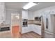 Bright kitchen boasts stainless steel appliances, granite countertops and view to the dining room at 3357 Huntwood Ct, Decatur, GA 30034