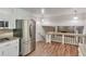 Modern kitchen boasts stainless steel appliances, ample counter space, and seamless transition to another living space at 3357 Huntwood Ct, Decatur, GA 30034