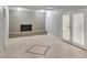 Spacious living room features a brick fireplace, tiled floors and access to the backyard at 3357 Huntwood Ct, Decatur, GA 30034