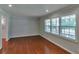 Bright living room with hardwood floors and large windows offering plenty of natural light at 3357 Huntwood Ct, Decatur, GA 30034