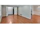 Open-concept living area showcasing gleaming hardwood floors and seamless flow to dining and kitchen spaces at 3357 Huntwood Ct, Decatur, GA 30034
