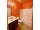 Cozy bathroom with a shower-tub combo, tile floors, and classic fixtures at 3429 Lake End Dr, Loganville, GA 30052
