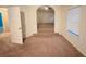 A carpeted bedroom with small elevated space and a window at 3429 Lake End Dr, Loganville, GA 30052