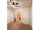 Neutral bedroom featuring a ceiling fan and doors to the bathroom and other rooms at 3429 Lake End Dr, Loganville, GA 30052