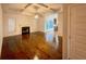 Spacious living room featuring hardwood floors, a fireplace, and a decorative ceiling at 3429 Lake End Dr, Loganville, GA 30052