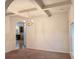 Bright living room with coffered ceilings, chandelier, and an open layout to the kitchen at 3429 Lake End Dr, Loganville, GA 30052