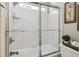 Clean bathroom features a tiled shower with a glass door and coordinated decor for a fresh look at 335 Scarborough Way, Alpharetta, GA 30022