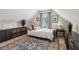 Cozy bedroom featuring a decorative rug, sloped ceilings, and stylish storage for an organized space at 335 Scarborough Way, Alpharetta, GA 30022