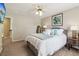 Neutral bedroom featuring a comfortable bed with soft pillows and a framed artwork adding a touch of elegance at 335 Scarborough Way, Alpharetta, GA 30022