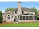 This house features a well-maintained lawn and charming back porch at 335 Scarborough Way, Alpharetta, GA 30022