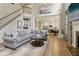 Comfortable living area with hardwood floors, open to the kitchen, and a staircase to the second floor at 335 Scarborough Way, Alpharetta, GA 30022