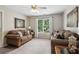 Living room with plush seating, neutral carpet, bright natural light and ample space at 335 Scarborough Way, Alpharetta, GA 30022