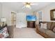 Cozy living room with plush couches, large tv and lots of natural light at 335 Scarborough Way, Alpharetta, GA 30022