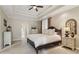 Relaxing main bedroom featuring a tray ceiling, neutral colors, and elegant furnishings at 335 Scarborough Way, Alpharetta, GA 30022