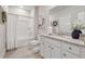Bright bathroom features a shower-tub combo, granite vanity, and neutral color palette at 4090 Sierra Knolls Ct, Cumming, GA 30040