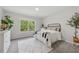 Bright bedroom with carpet, a large window, and modern decor at 4090 Sierra Knolls Ct, Cumming, GA 30040