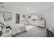 A bedroom with a white bed, vanity, and soft, neutral carpet at 4090 Sierra Knolls Ct, Cumming, GA 30040