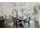 Dining room with hardwood floors, a coffered ceiling, and open access to other living spaces at 4090 Sierra Knolls Ct, Cumming, GA 30040