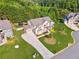 Stunning home featuring manicured landscaping, a long driveway, and a welcoming entrance at 4090 Sierra Knolls Ct, Cumming, GA 30040