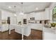 Modern kitchen with a large center island, pendant lighting and stainless steel appliances at 4090 Sierra Knolls Ct, Cumming, GA 30040