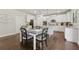 Charming eat-in kitchen with white cabinets, granite countertops, and stainless appliances at 4090 Sierra Knolls Ct, Cumming, GA 30040