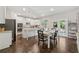 Bright kitchen boasts stainless appliances, a center island, and backyard access at 4090 Sierra Knolls Ct, Cumming, GA 30040