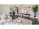 Cozy living room showcasing hardwood floors, a large rug and stylish furnishings at 4090 Sierra Knolls Ct, Cumming, GA 30040