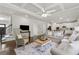 Spacious open floorplan living room and kitchen features hardwood floors at 4090 Sierra Knolls Ct, Cumming, GA 30040