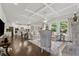 Open-concept living room and kitchen features hardwood floors and a cozy fireplace at 4090 Sierra Knolls Ct, Cumming, GA 30040