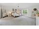 Spacious main bedroom with tray ceilings, carpet flooring, and abundant natural light at 4090 Sierra Knolls Ct, Cumming, GA 30040