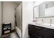 Modern bathroom with a single vanity, a tiled bath/shower, and neutral colors at 5200 Peachtree Rd # 1104, Atlanta, GA 30341